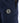 navy blue track pants featuring a black hexagonal logo patch and a zippered side pocket