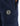 navy blue track pants featuring a black hexagonal logo patch and a zippered side pocket