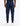 back view of navy track pants with cargo pockets and cuffed hems worn with white sneakers by a model