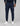 K-Star 7 Originals navy track pants with drawstring waist, zip pockets, patch logo on the right thigh, cuffed ankles.