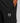 black track pants with a vertical zip pocket and a hexagonal logo patch near the hip