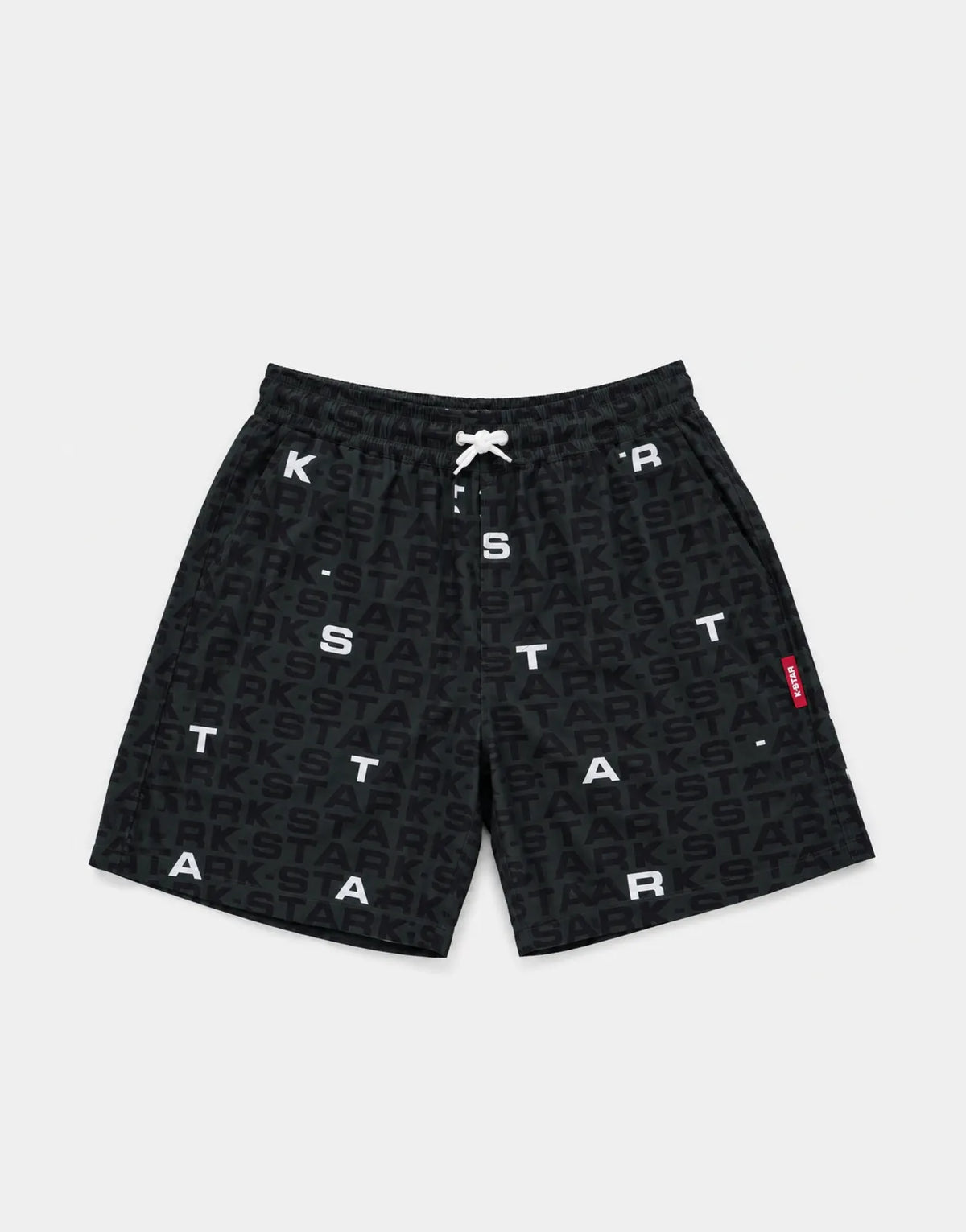 black swim shorts with an allover dark letter pattern and a white drawstring; white letters scattered across the fabric