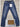 blue denim jeans with a white tag attached at the front waistband, displayed on a light wood background