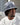 man wearing a light denim bucket hat with distress and a stitched logo by K-Star 7 Originals