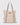 beige shopper bag with wide taupe straps, front zip pocket, side bungee cords, and a circular logo with a star by K-Star