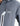 Close-up of a grey Blizzard Mens Softshell Jacket featuring a white panel with a zipper pocket and a K7 logo, worn by a