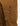 brown cargo trousers with a zippered side pocket and a small zipper pocket on the thigh.