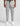 grey track pants with cargo pockets, drawstring waist, black zip pockets, patch emblem on left thigh, cuffed ankles, white