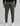 back view of olive green track pants by k-star 7 originals with a rear patch pocket and ribbed cuffs, worn with white
