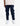A child wears navy blue Ghost Boys V2.0 Trackpants, featuring a tapered fit and gathered cuffs, paired with white sneakers.