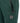 Close-up of Ghost Men's V2.0 Trackpants in dark green, featuring a zippered side pocket and a round 'Originals 1968' logo