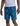 Man wearing blue Logo Mens Swimshorts with a vibrant teal and blue leaf pattern, featuring a drawstring. Paired with a light