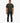 Full body shot of a male model wearing a dark green Louis Mens Knitted Golfer polo shirt, black jeans, and white sneakers.