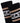 Nadal black athletic socks with white and tan stripes and a K star logo, seen in a close-up studio shot.