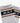 Pair of Nadal light gray ribbed athletic socks featuring a black band with a white KAP logo and distinctive brown and white