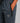 dark blue trackpants with a black zippered side pocket, elastic drawstring waist, and a hex logo patch on the thigh