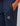 navy trackpants with a zip pocket and a small hex patch logo at the thigh