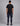 back view of a man wearing a black short sleeve tee and navy cargo pants against a grey studio backdrop