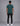 back view of man in teal short sleeve t shirt with black jeans and white sneakers