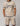 beige two piece sports set with navy trim; short sleeve tee and matching shorts with drawstrings and bold branding
