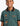 A young boy wearing a green Tito boys polo shirt with graphic prints and a black and orange collar.