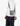 Person wearing a khaki green Trevor sling bag with a black strap across the chest, featuring drawstring detailing and a
